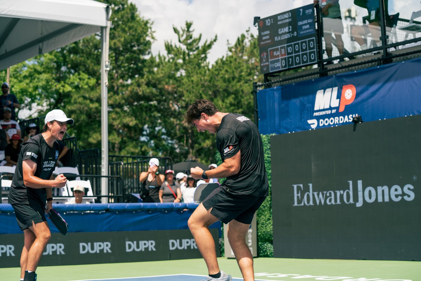 Ryan Morneau celebrating a point with his doubles partner