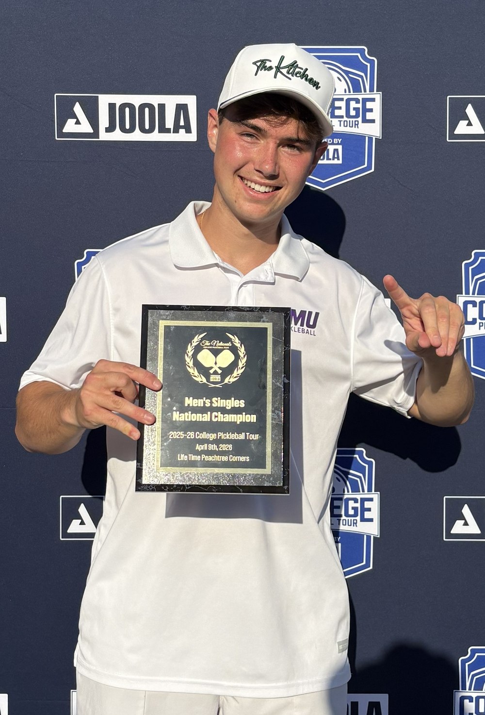 Ryan Morneau holding his Men's Singles National Champion plaque